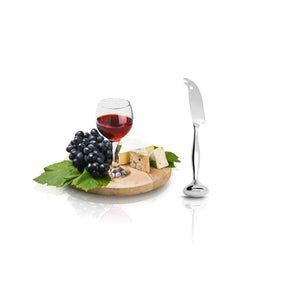 IPAC Standing Cheese Knife beside a small charcuterie plate of grapes and cheese, as well as a glass of red wine