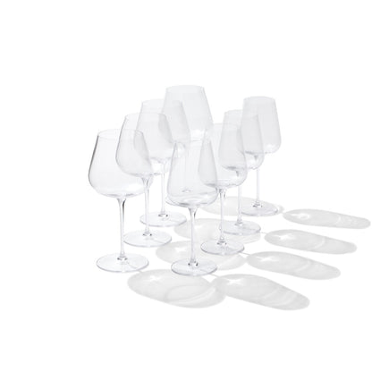 4 red wine glasses next to 4 white wine glasses